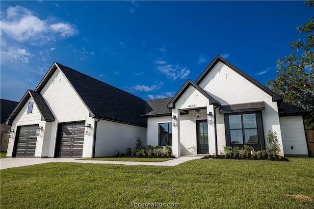 view of front facade featuring a front yard and a garage