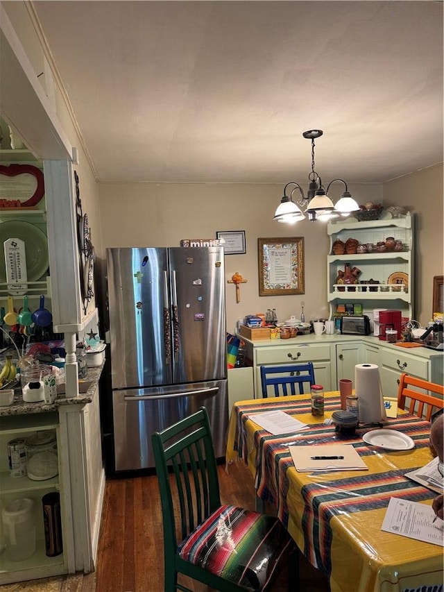 610 Calvert St, Hearne, TX 77859 - dining room with dark wood finished floors and a chandelier