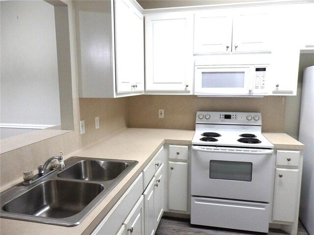 1702 Deacon Dr Unit 101, College Station, TX 77845 - kitchen with white appliances, a sink, white cabinetry, and light countertops