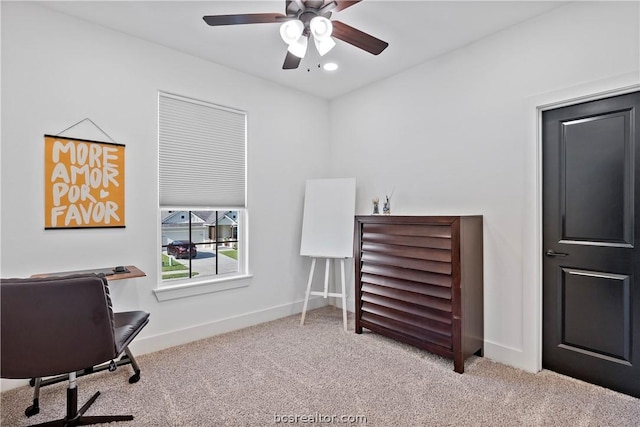 carpeted office with ceiling fan