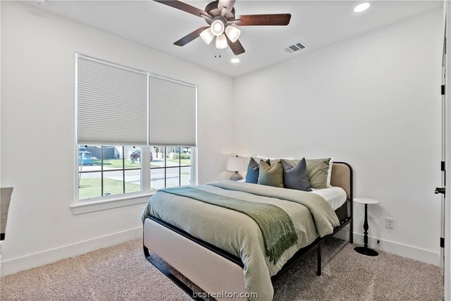 bedroom with ceiling fan and carpet