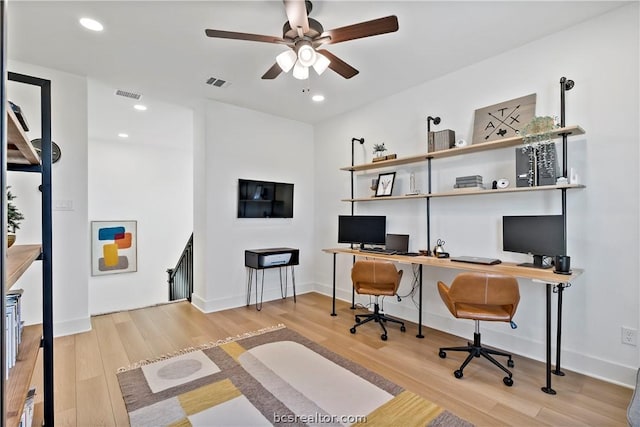 office with hardwood / wood-style floors and ceiling fan