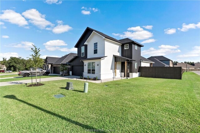 view of property exterior with a yard and a garage