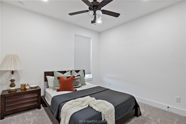 bedroom featuring ceiling fan and light colored carpet