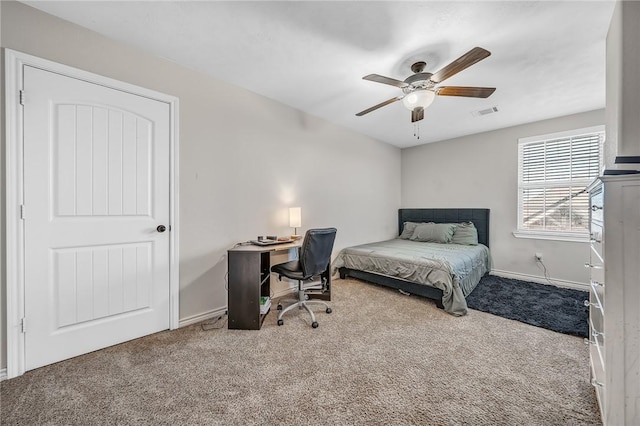 carpeted bedroom with baseboards, visible vents, and ceiling fan