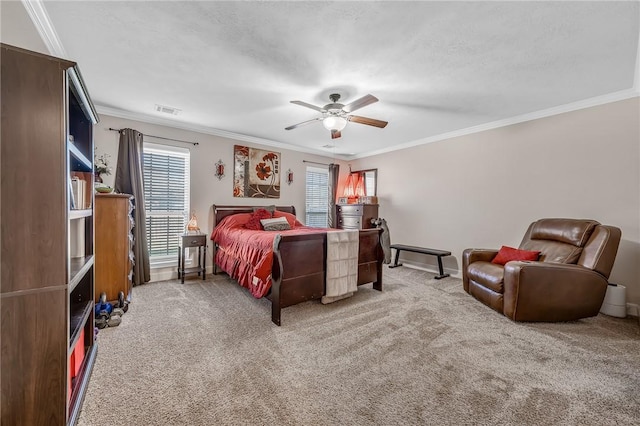 bedroom featuring carpet flooring, multiple windows, crown molding, and visible vents