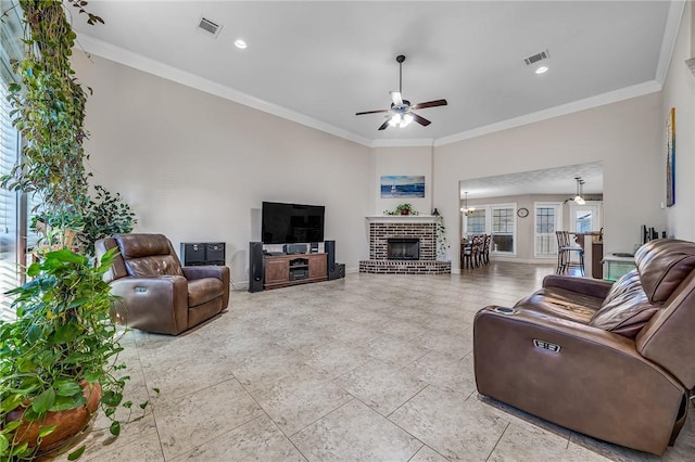 living area with ceiling fan, visible vents, and ornamental molding