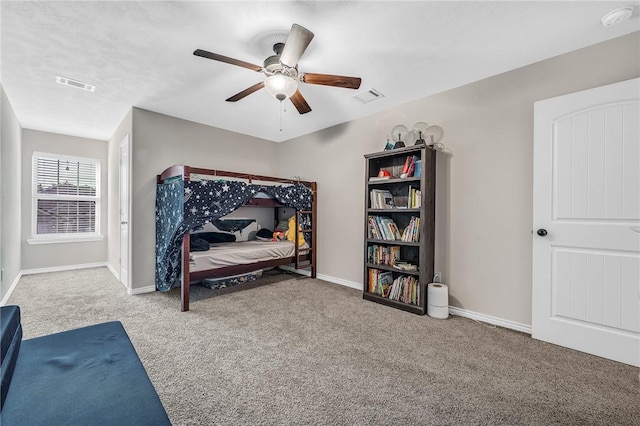 carpeted bedroom featuring visible vents, ceiling fan, and baseboards