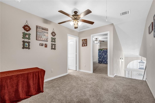 unfurnished bedroom with visible vents, baseboards, ceiling fan, and carpet flooring