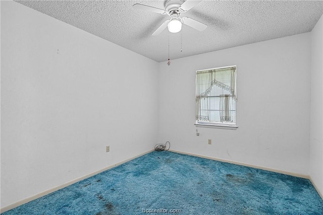 unfurnished room with carpet flooring, ceiling fan, and a textured ceiling