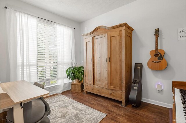 office area with dark wood-type flooring