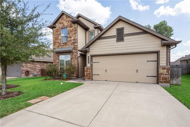 craftsman house with a garage and a front lawn