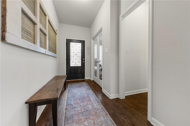 foyer featuring dark wood-type flooring