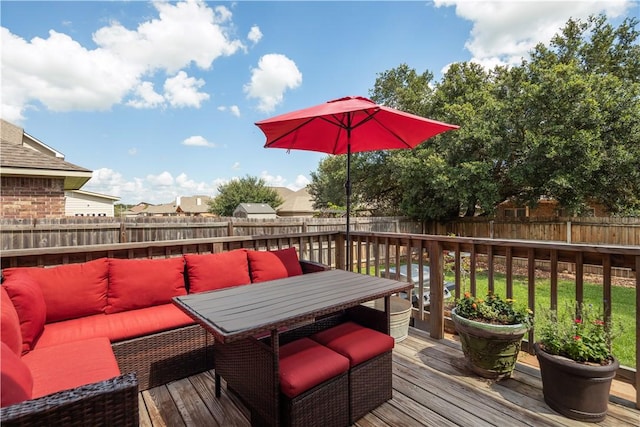 wooden deck featuring an outdoor hangout area