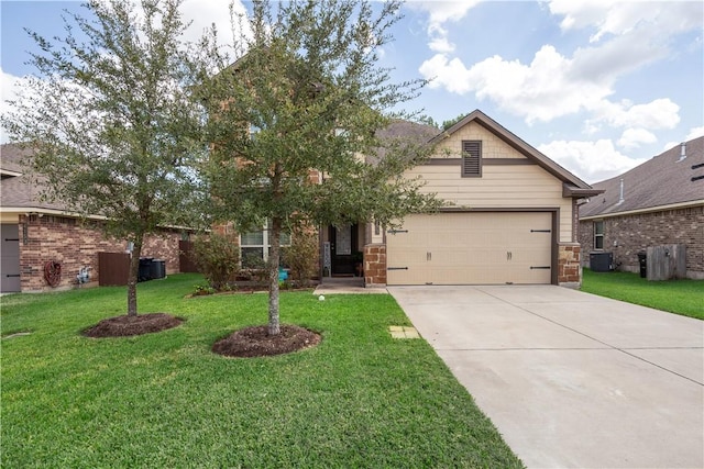 view of front of home featuring a garage, central AC, and a front lawn