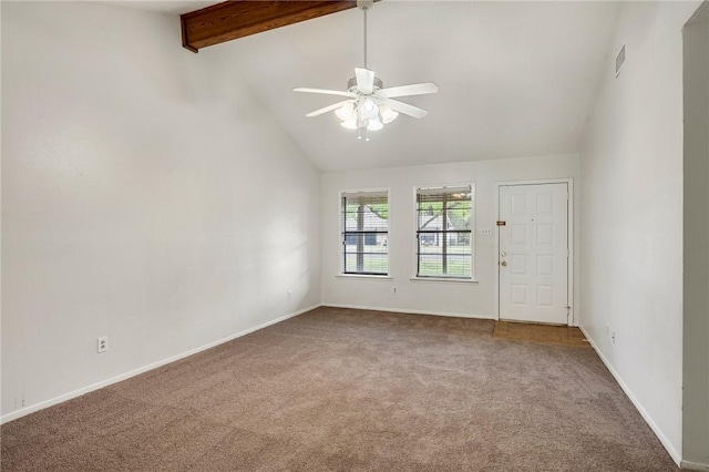 carpeted empty room with beam ceiling, high vaulted ceiling, and ceiling fan