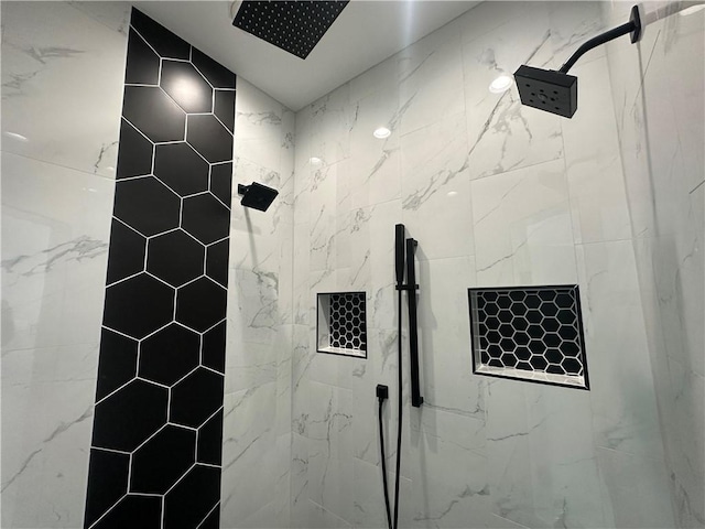 bathroom with a tile shower