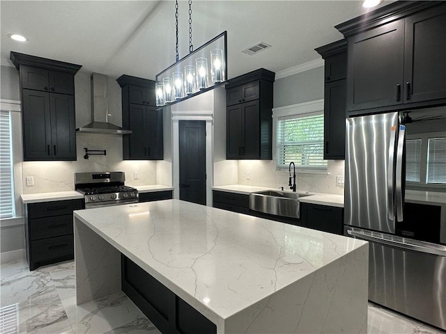 kitchen featuring stainless steel appliances, a kitchen island, wall chimney exhaust hood, and light stone counters