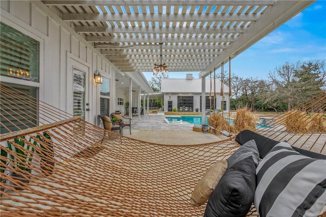 view of patio / terrace with an outdoor pool and a pergola