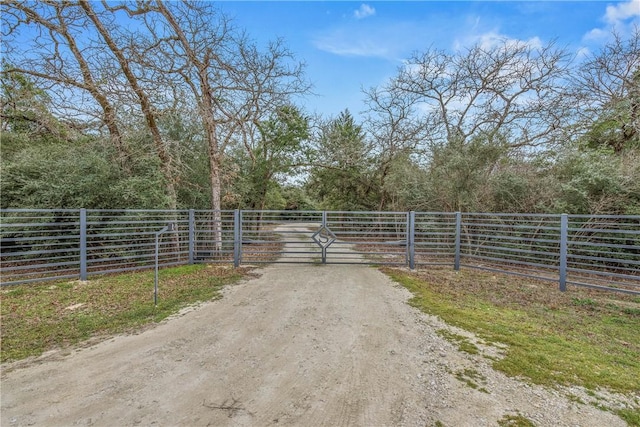 view of gate featuring fence