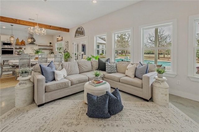 living room with recessed lighting, concrete floors, a chandelier, beamed ceiling, and baseboards