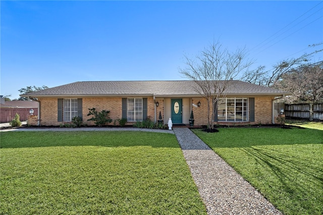 ranch-style house with a front lawn