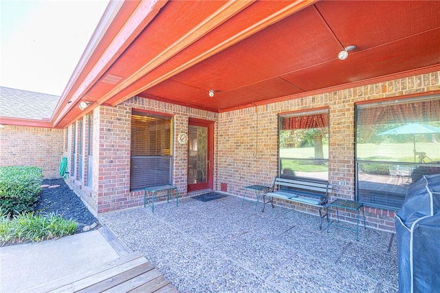 doorway to property with a patio