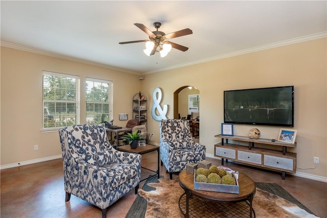 living area featuring baseboards, ornamental molding, a ceiling fan, and arched walkways