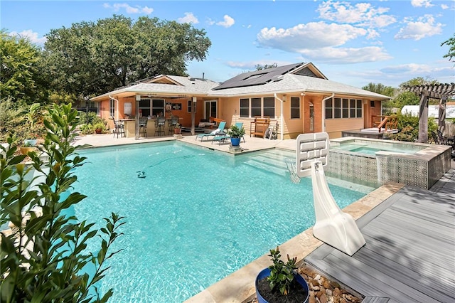 1013 Winding Rd, College Station, TX 77840 - pool featuring a patio, a sunroom, outdoor dry bar, an in ground hot tub, and a pergola