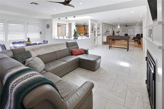 1013 Winding Rd, College Station, TX 77840 - living area with ceiling fan, visible vents, and recessed lighting