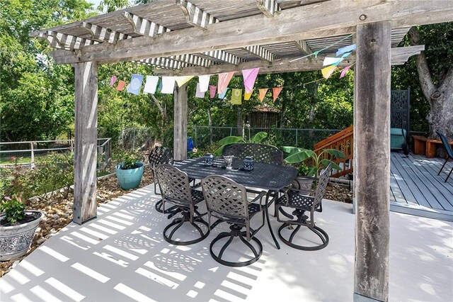 1013 Winding Rd, College Station, TX 77840 - view of patio / terrace featuring outdoor dining space, a fenced backyard, a deck, and a pergola