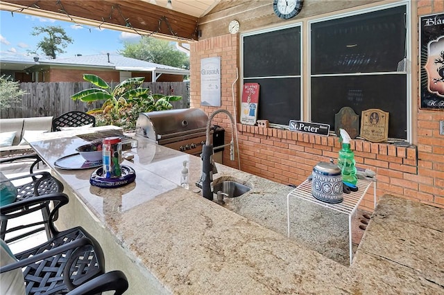 1013 Winding Rd, College Station, TX 77840 - view of patio / terrace featuring fence, outdoor dry bar, a sink, and area for grilling
