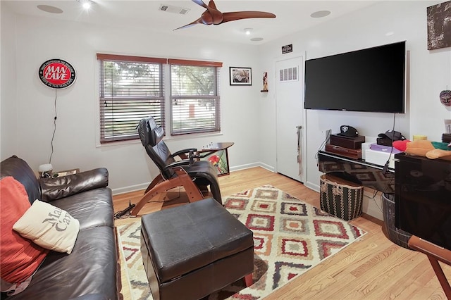 1013 Winding Rd, College Station, TX 77840 - living area with light wood-style floors, ceiling fan, visible vents, and baseboards