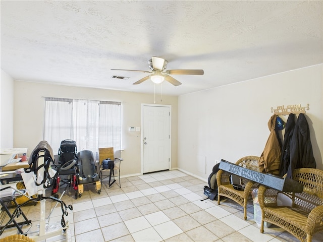 1008 Bittle Ln, Bryan, TX 77803 - playroom with a ceiling fan and light tile patterned floors