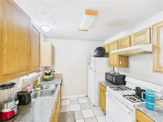 1008 Bittle Ln, Bryan, TX 77803 - kitchen featuring white appliances, under cabinet range hood, and light brown cabinetry