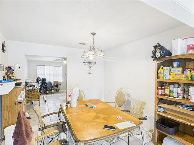 1008 Bittle Ln, Bryan, TX 77803 - dining area featuring a chandelier and light tile patterned floors