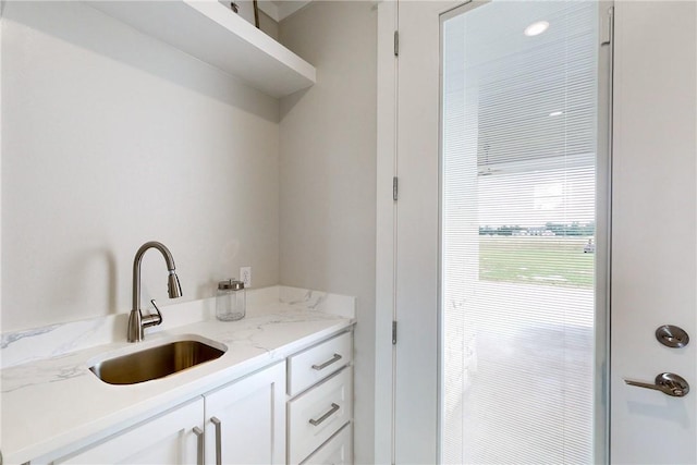 7844 Mathis Creek Dr, Bryan, TX 77808 - laundry area with a sink
