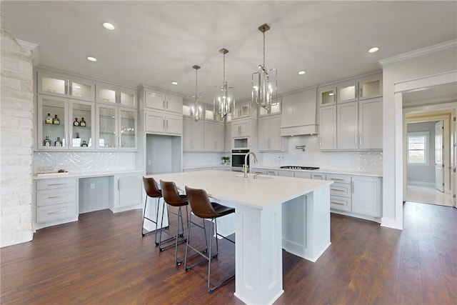 7844 Mathis Creek Dr, Bryan, TX 77808 - kitchen featuring a large island, recessed lighting, stovetop, a sink, and backsplash