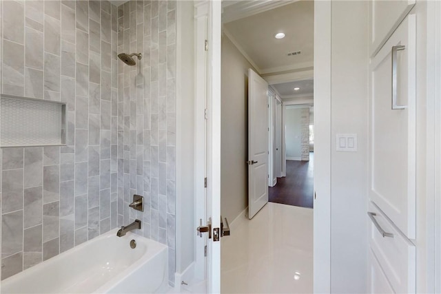 7844 Mathis Creek Dr, Bryan, TX 77808 - bathroom with crown molding, recessed lighting, visible vents, and bathing tub / shower combination