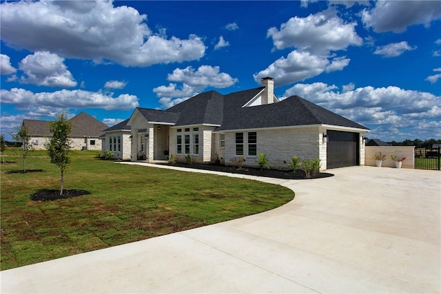7844 Mathis Creek Dr, Bryan, TX 77808 - view of front of home with fence, a front yard, stone siding, a chimney, and driveway