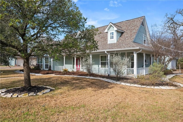 view of front of property with a front yard and covered porch