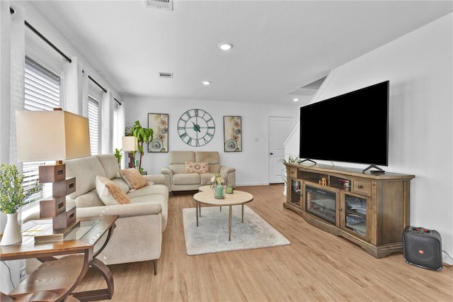 317 Riverwood Village Ln, Sealy, TX 77474 - living area with wood finished floors, baseboards, and recessed lighting