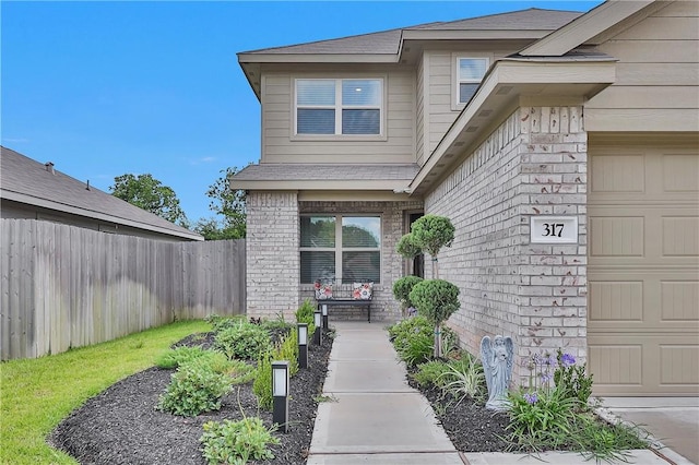 317 Riverwood Village Ln, Sealy, TX 77474 - doorway to property featuring an attached garage