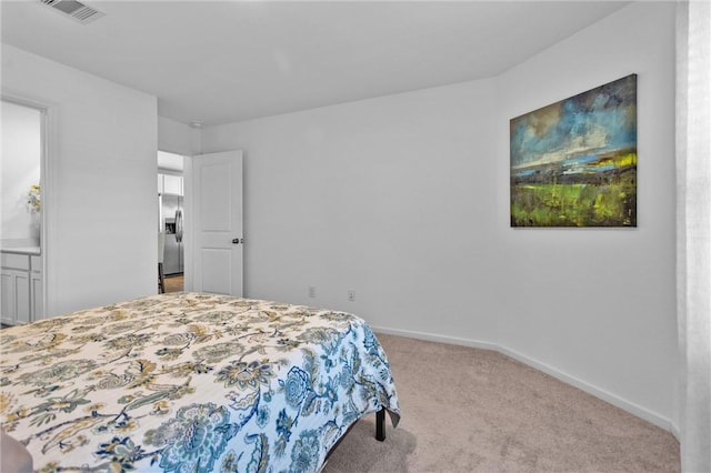 317 Riverwood Village Ln, Sealy, TX 77474 - bedroom with stainless steel refrigerator with ice dispenser, carpet floors, and baseboards