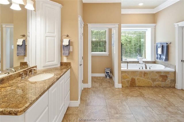 bathroom with vanity and tiled tub