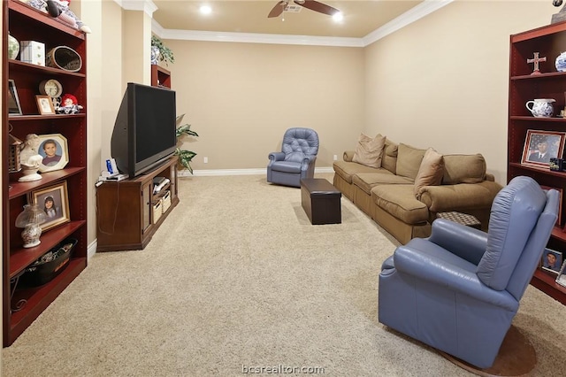 living room featuring ceiling fan, crown molding, and carpet floors