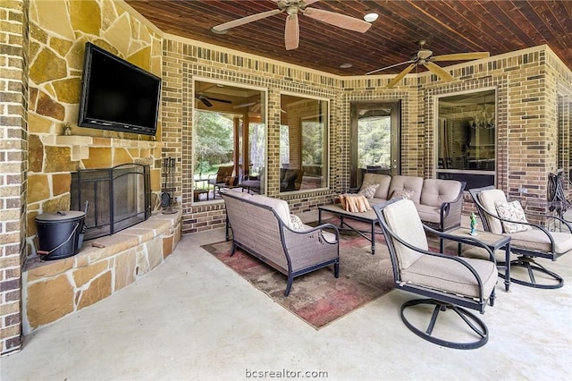 view of patio with outdoor lounge area and ceiling fan