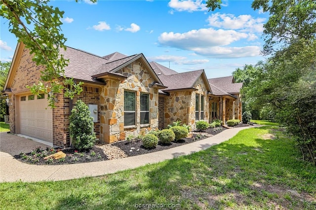 view of front facade featuring a garage and a front lawn