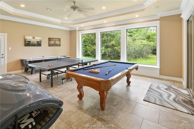 game room with a raised ceiling, ceiling fan, crown molding, light tile patterned floors, and billiards