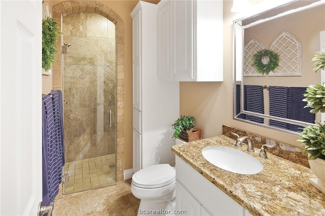 bathroom with vanity, toilet, and walk in shower